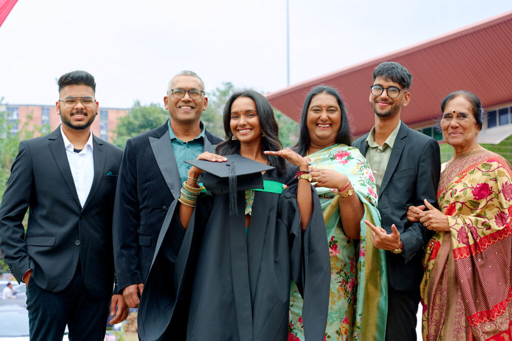 Ms Mayuri Chinniah with (left to right) Mr Yadhir Ramdutt; her parents, Mr Logan Chinniah and Mrs Devashnee Chinniah; Mr Jaelen Chinniah; and Ms Asodhee Pillay.